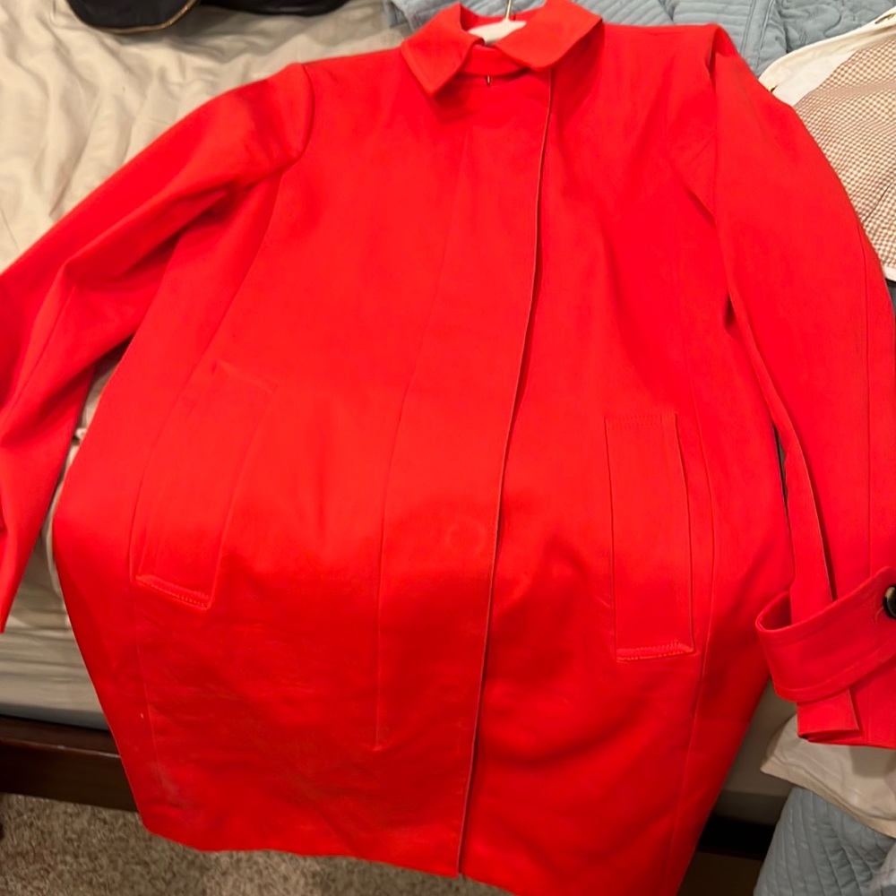 AT trench coat in bright/burnt orang color